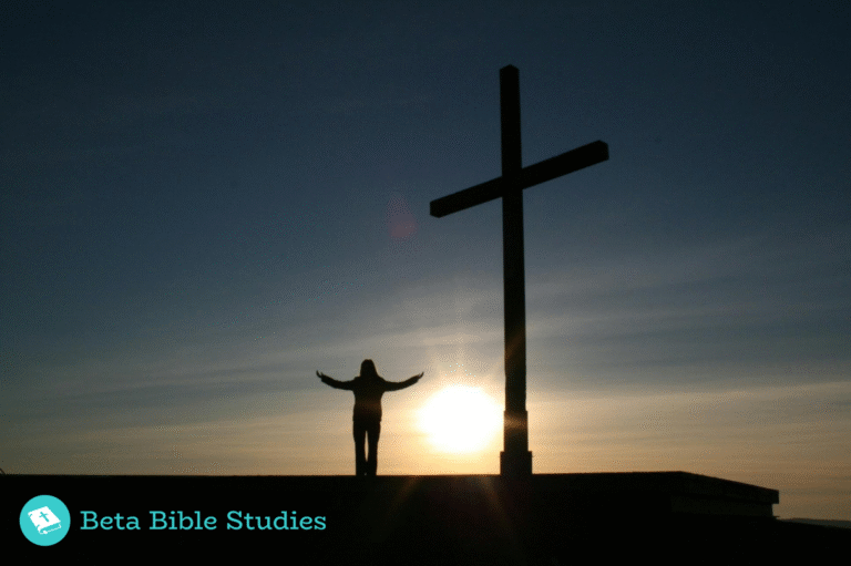 Silhouette of a person standing before a cross at sunrise with arms open, symbolizing surrender to God and freedom from worldly influences.